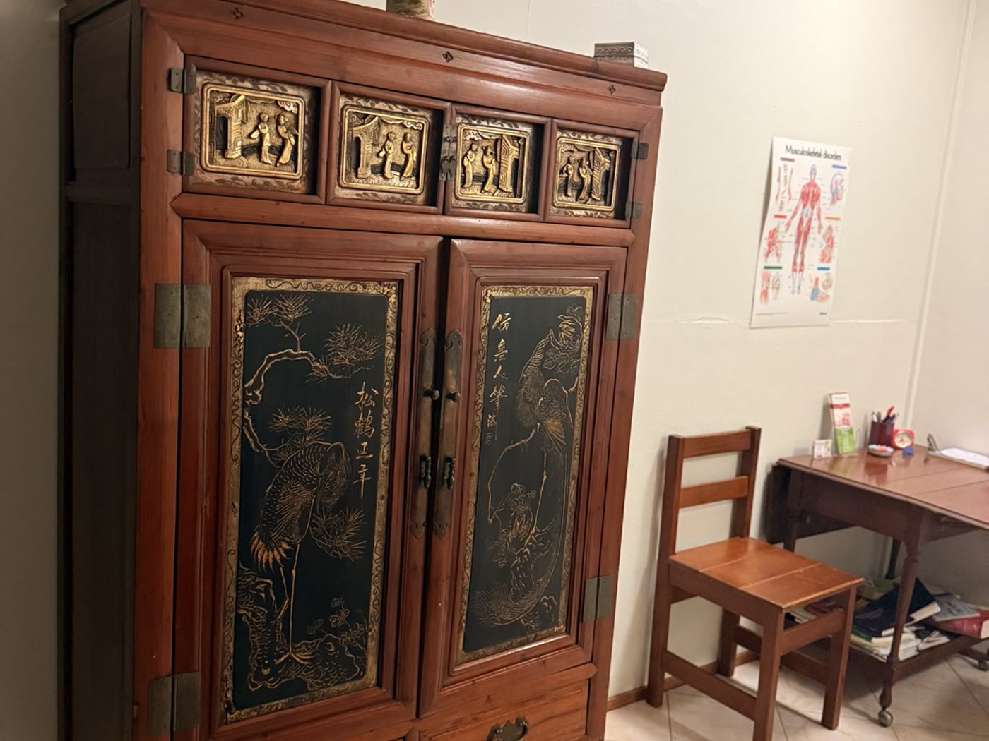 Antique Chinese cabinet in the treatment room, beside the treatment table