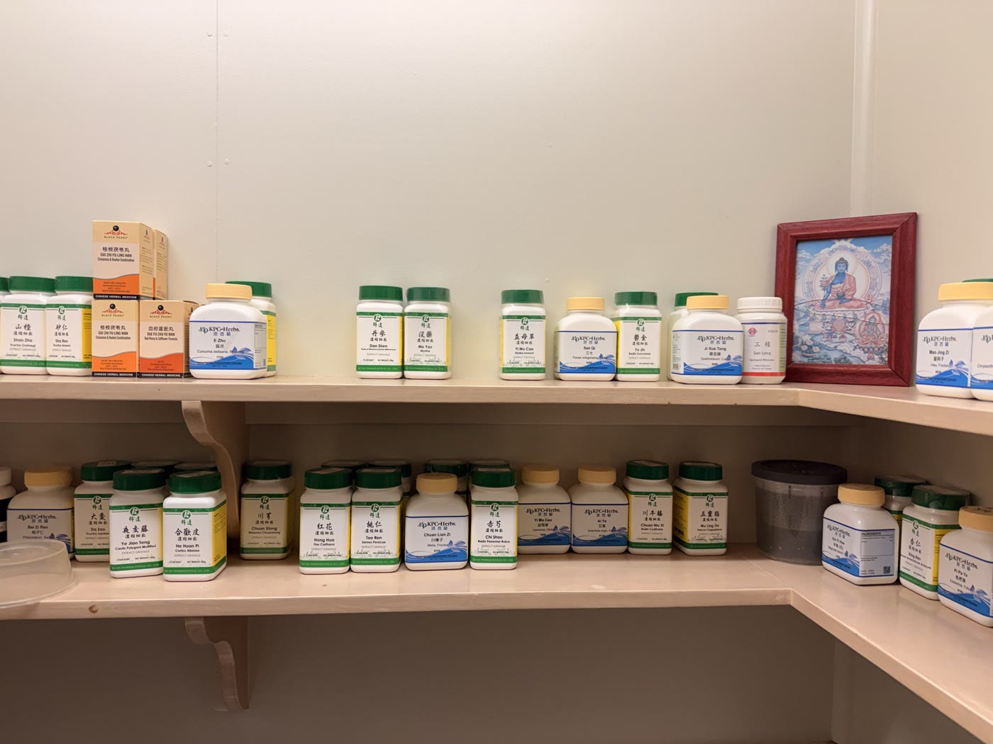 Shelves of Chinese herbal medicine in the clinic’s dispensary
