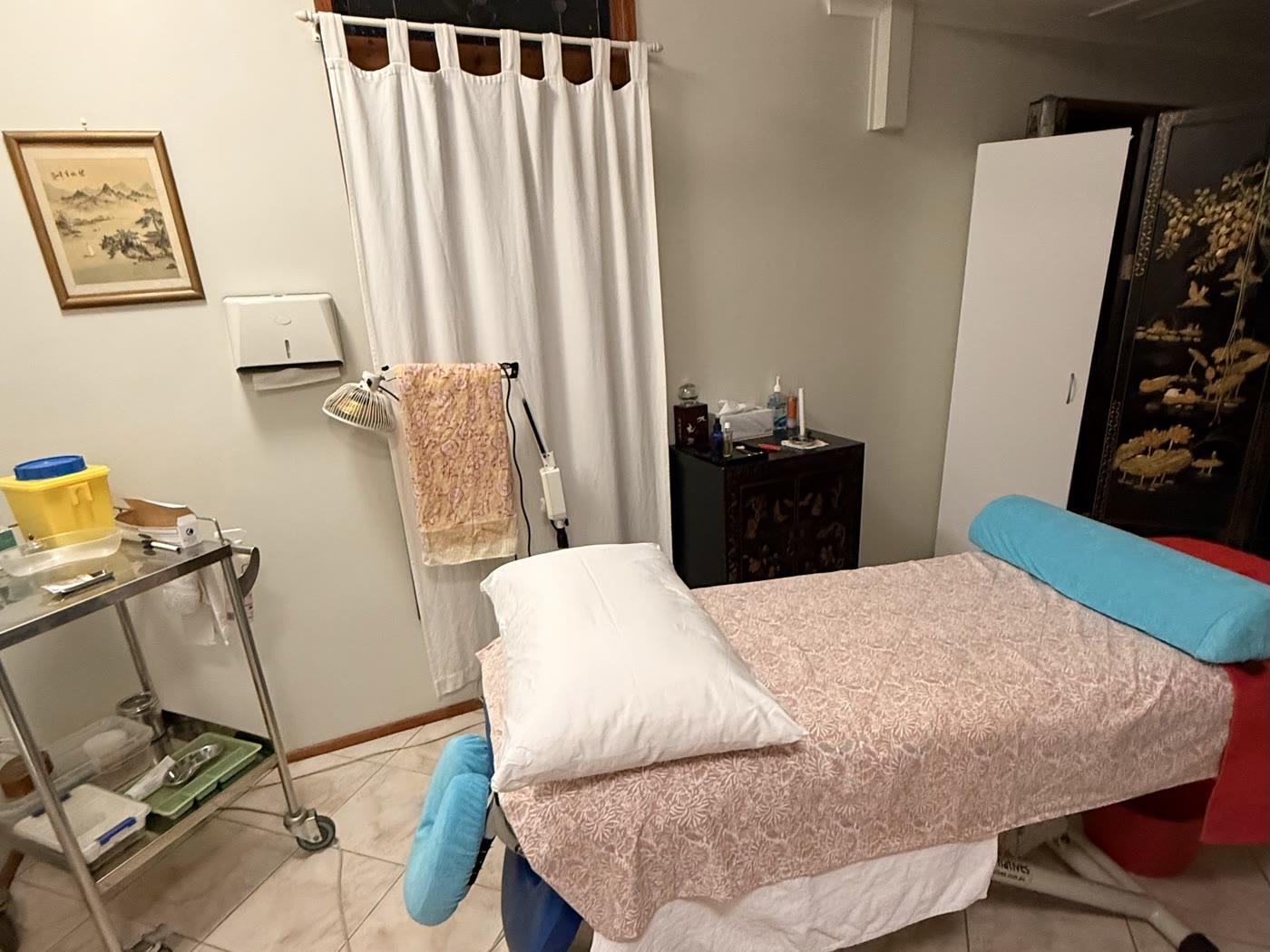 The treatment room, with treatment table, linen and equipment trolley ready